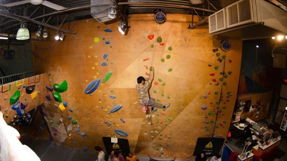 Climber lowering off the auto-belay wall