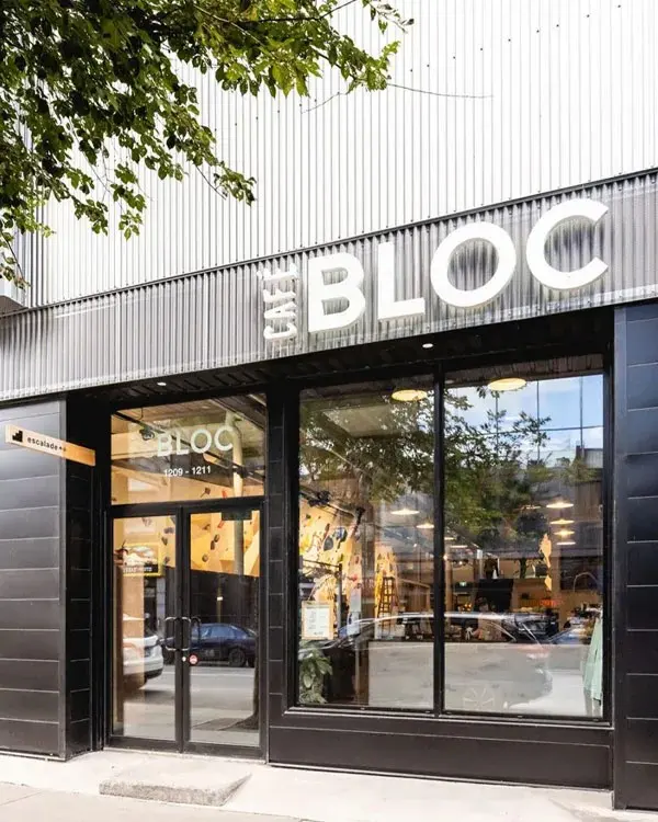 Black shopfront with a large Café Bloc sign above glass doors