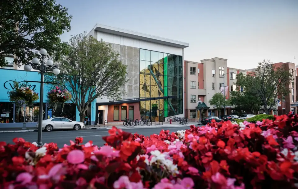 Crag X's glass-fronted building on Pandora Avenue in downtown Victoria, with the climbing wall visible inside