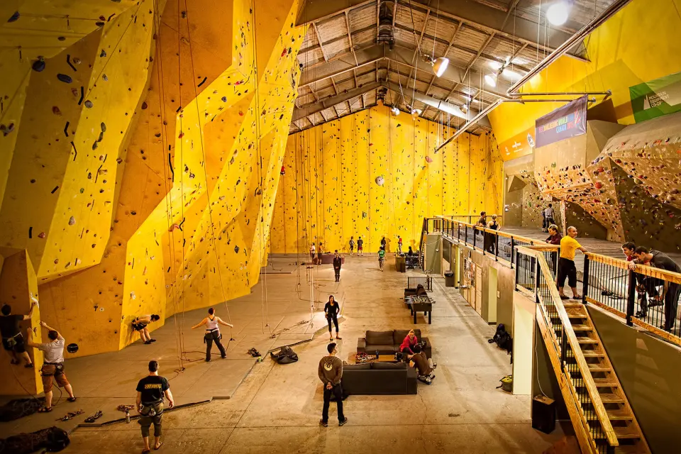 Towering yellow roped walls and a mezzanine in the main hall at Gravity Climbing Gym, Hamilton