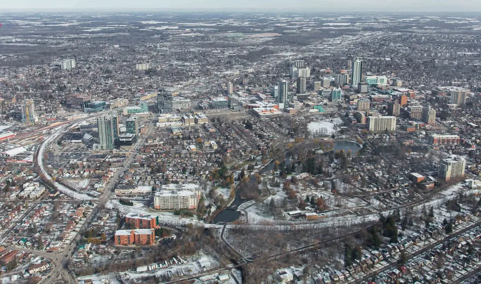 Aerial view of downtown Kitchener in winter, with Victoria Park in the foreground