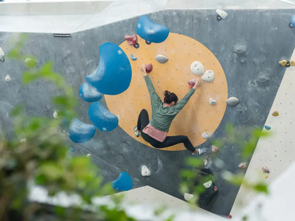 Climber on the outdoor bouldering wall