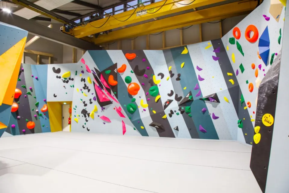 Bouldering walls with striped panels and colourful holds