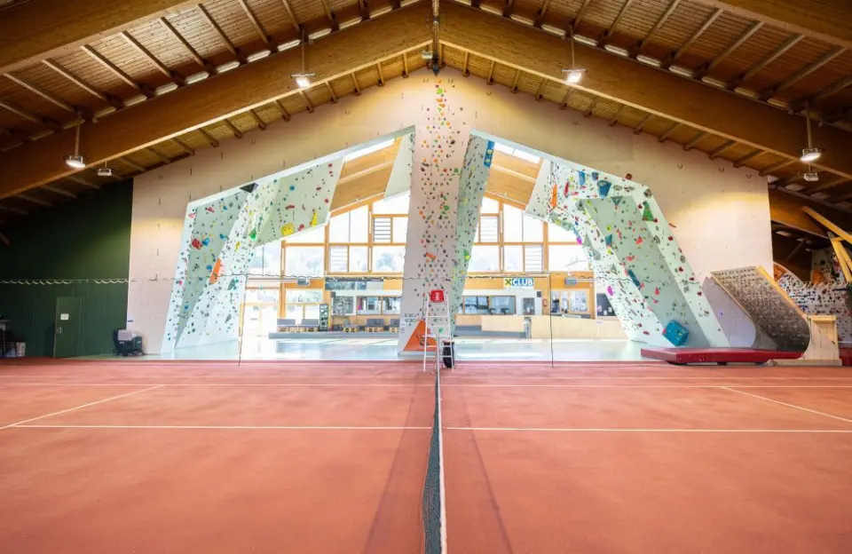 Climbing walls seen across the indoor tennis courts