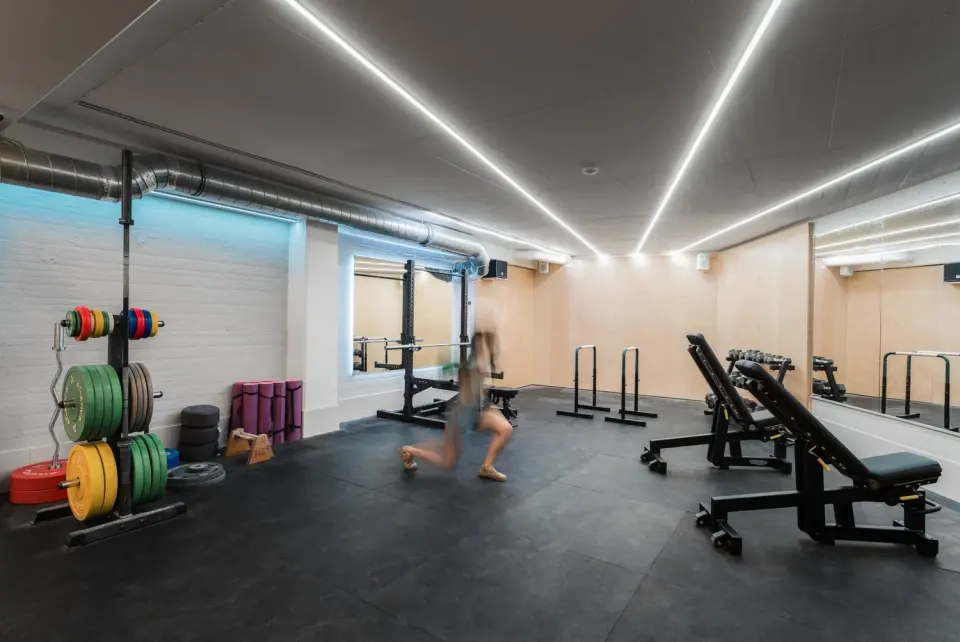 Training room with weight plates, racks and benches