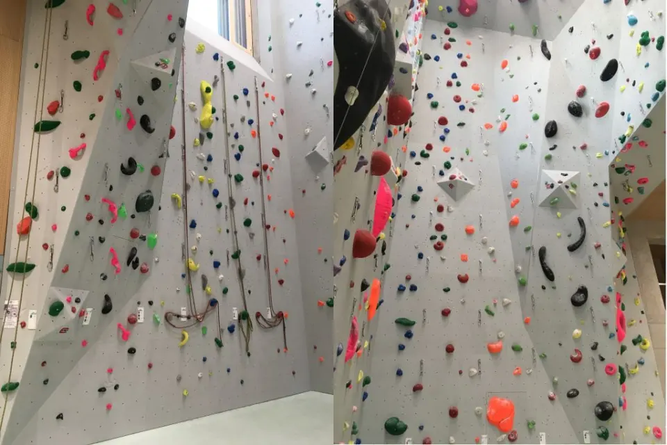Two views of the tall lead walls, covered in coloured holds and volumes, with ropes hanging down