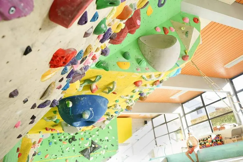 Overhanging boulder wall with large volumes, seen from below