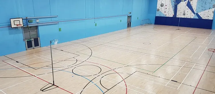 Sports hall with the climbing wall at the far end