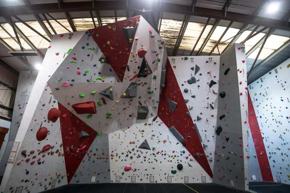 Steep red and white bouldering walls