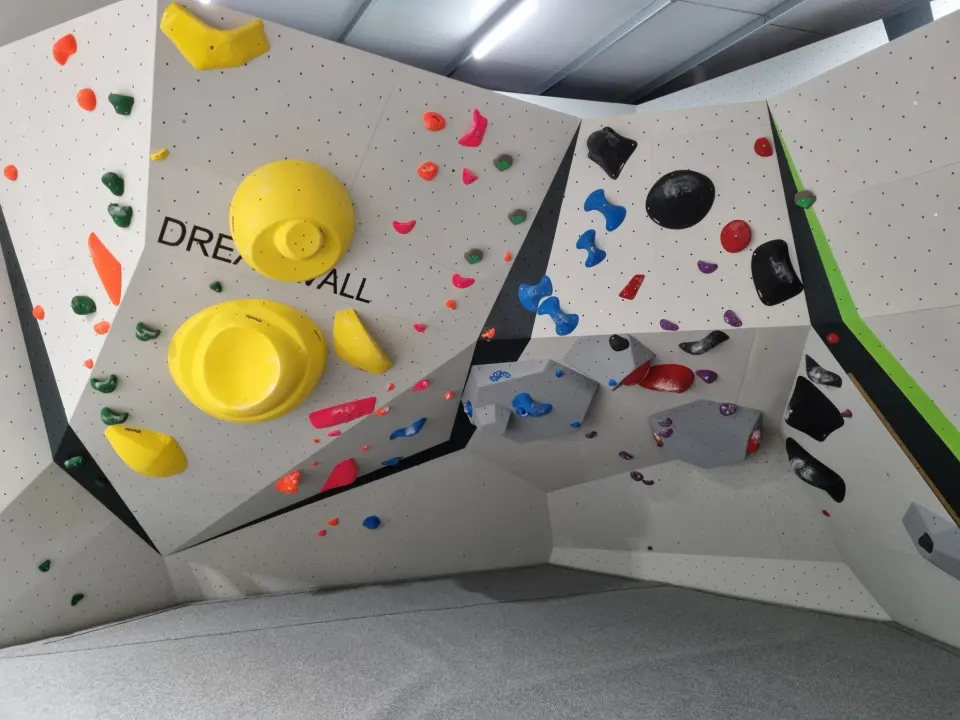 Bouldering cave with large yellow volumes
