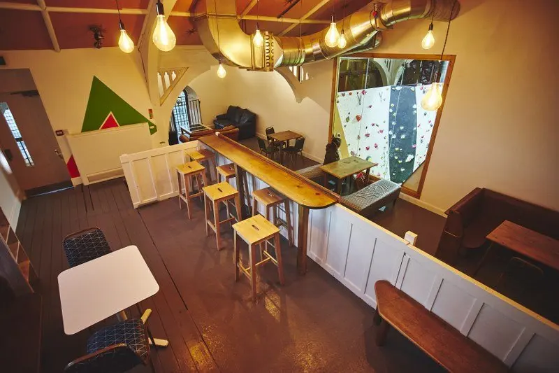 Upstairs café in the converted church with a view of the climbing wall