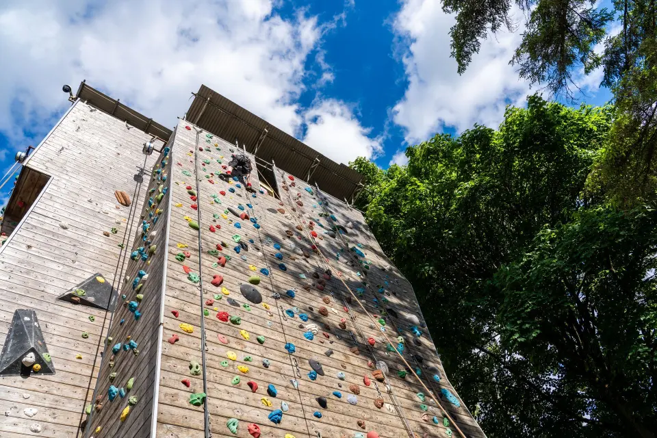 The timber climbing tower against a blue sky