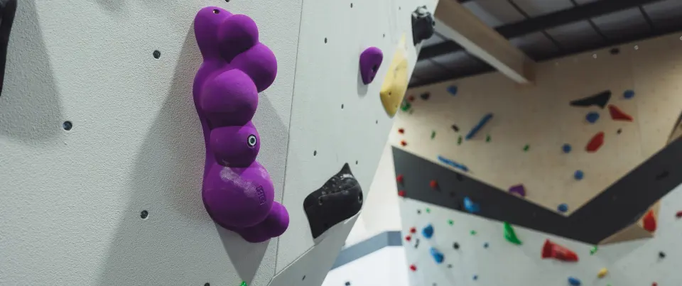 Large purple volume on the bouldering wall