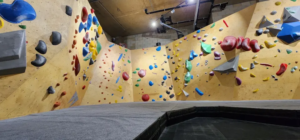 Wide view of the plywood bouldering walls and volumes