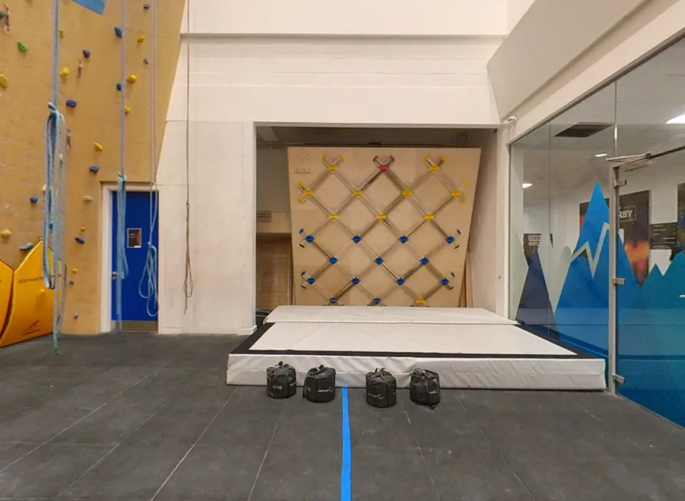 Lattice training board above a matted area