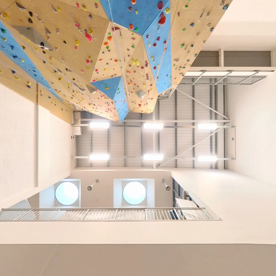 Looking up the lead wall towards the roof and abseil balcony