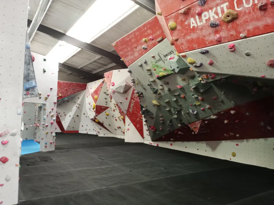 Overhanging red and white bouldering walls