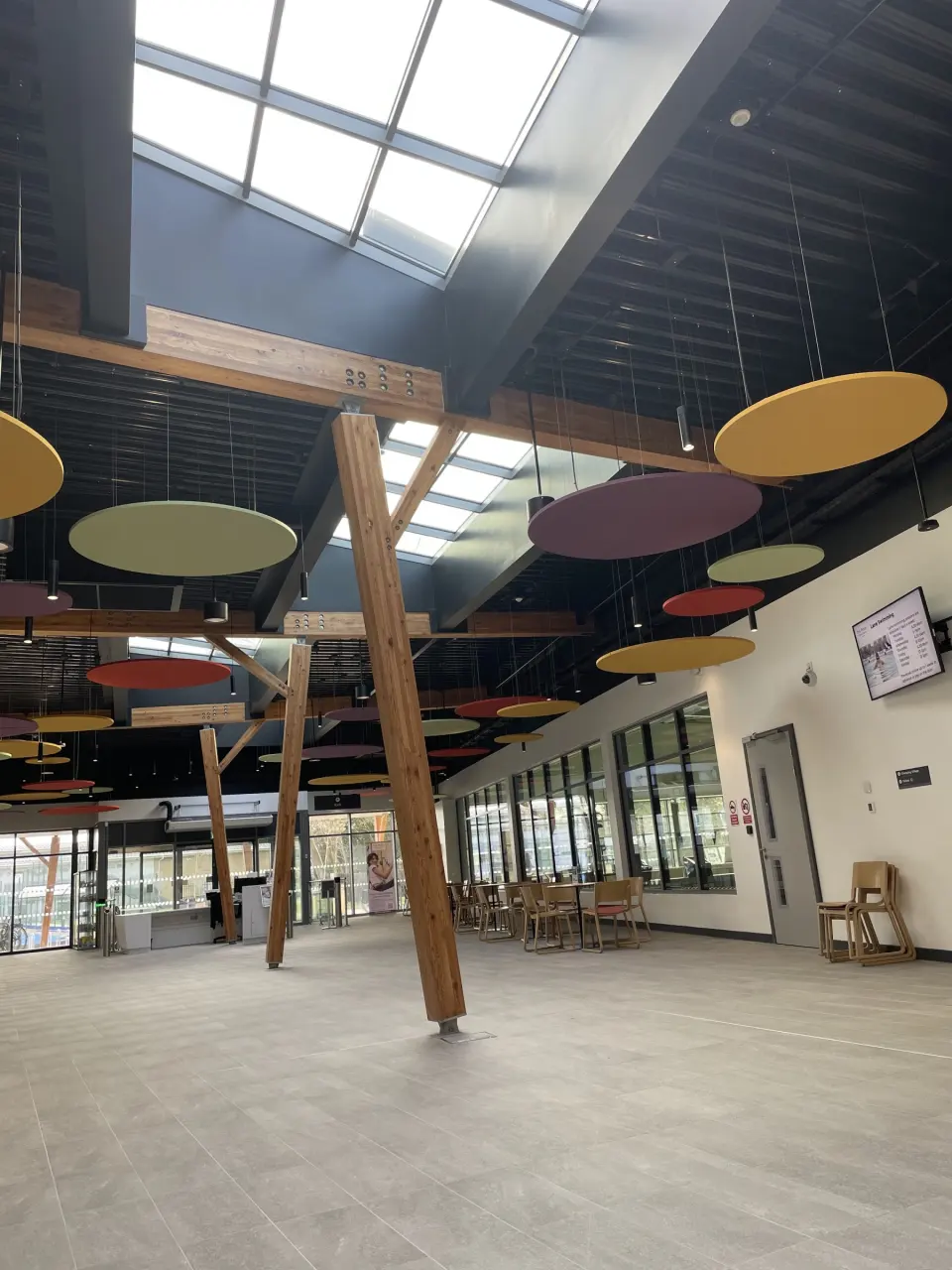 The sports centre's timber-framed atrium with seating