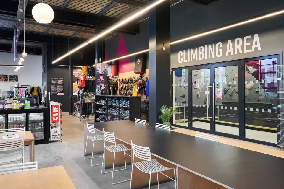 Café seating and shop by the doors to the climbing area