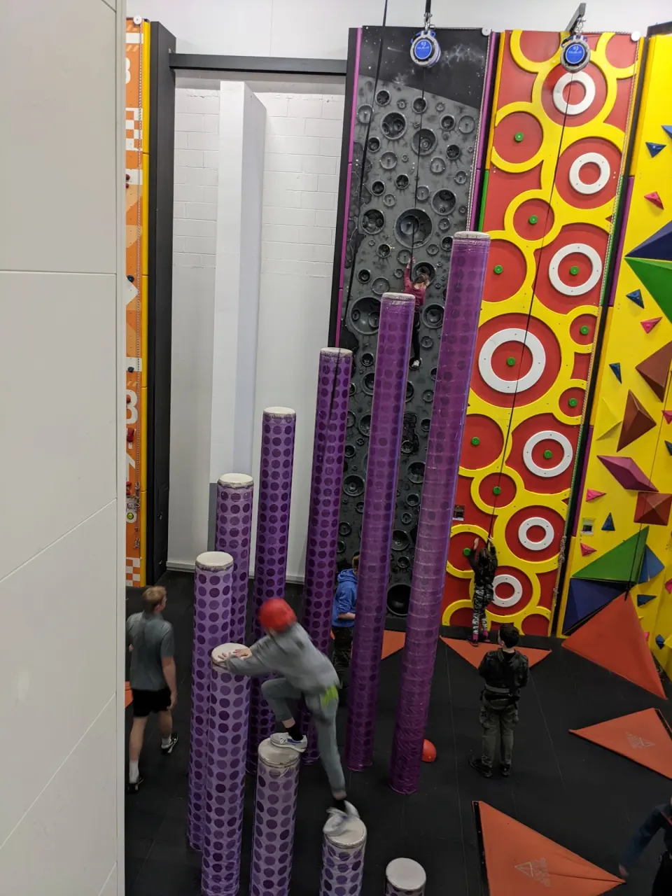 Climbers on the stepped purple columns, seen from above