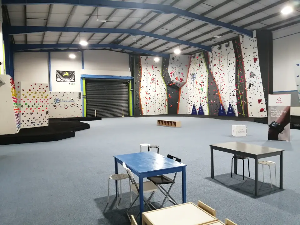 View across the hall to the roped walls, with tables in the foreground