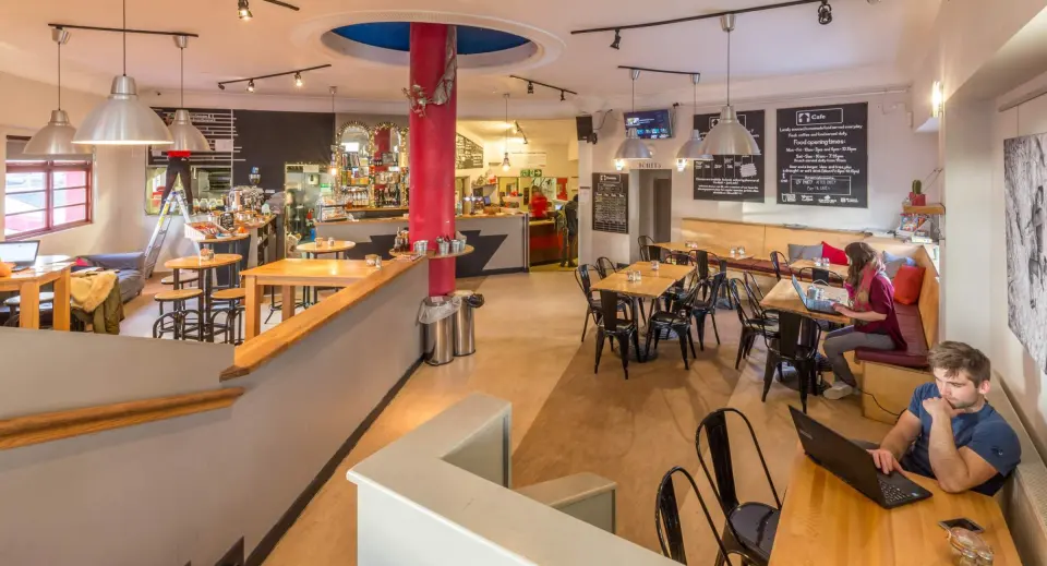 The café-bar with wooden tables
