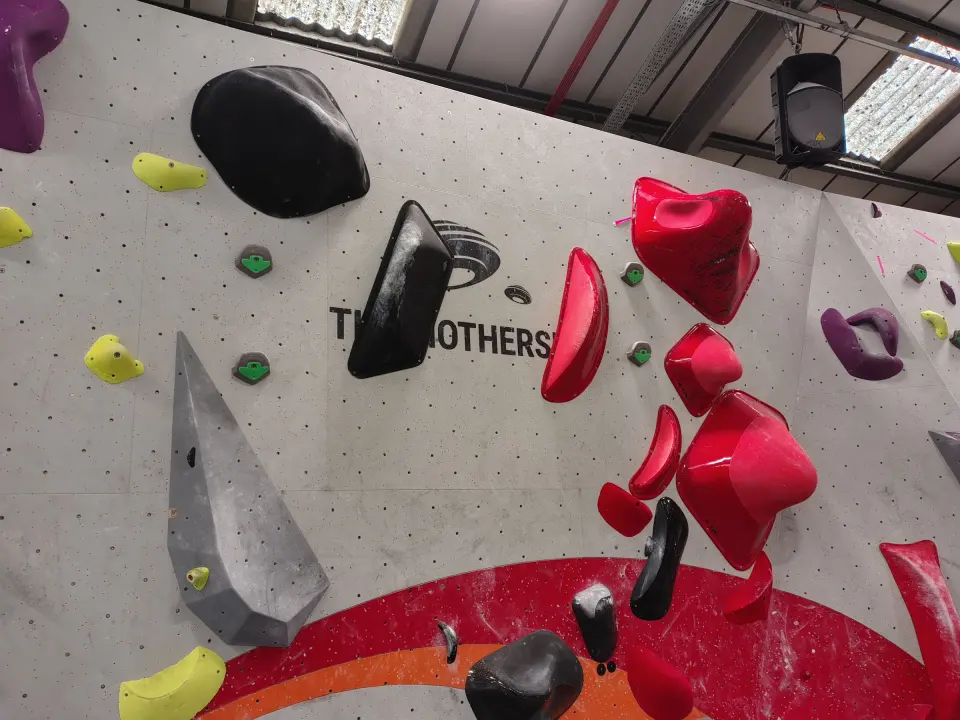 Wall with big black and red volumes and The Mothership branding