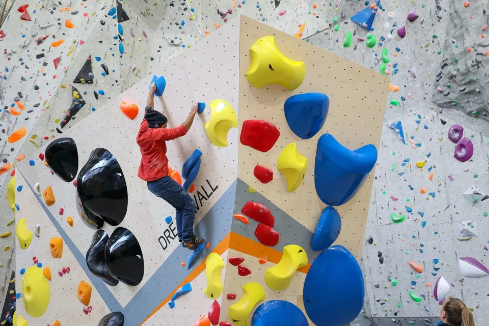 Climber on big volumes on the new boulders