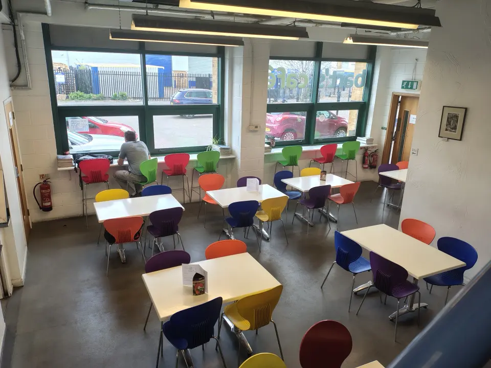The café seating area with colourful chairs