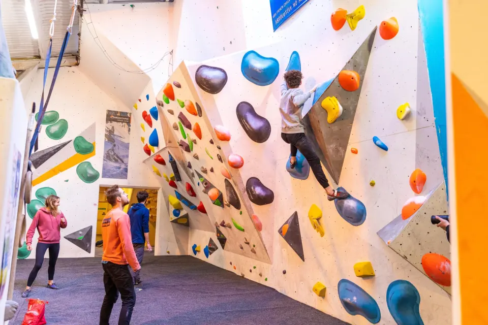 Bouldering on an angled wall with volumes