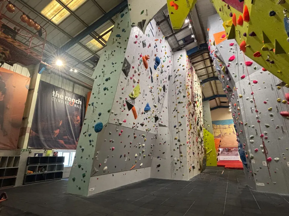 Tall roped climbing walls and buttresses in the main hall