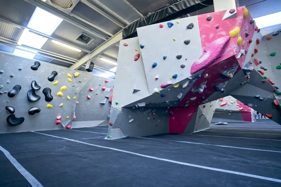The bouldering hall with its freestanding prow and matted floor