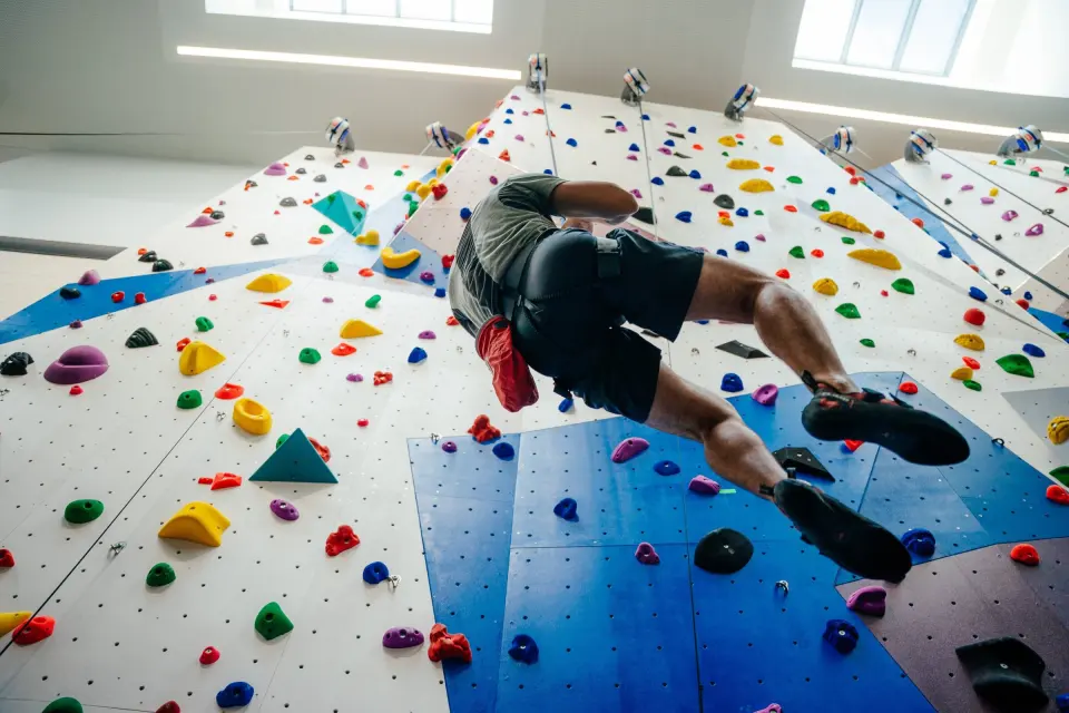 Climber on the auto-belay wall, seen from below