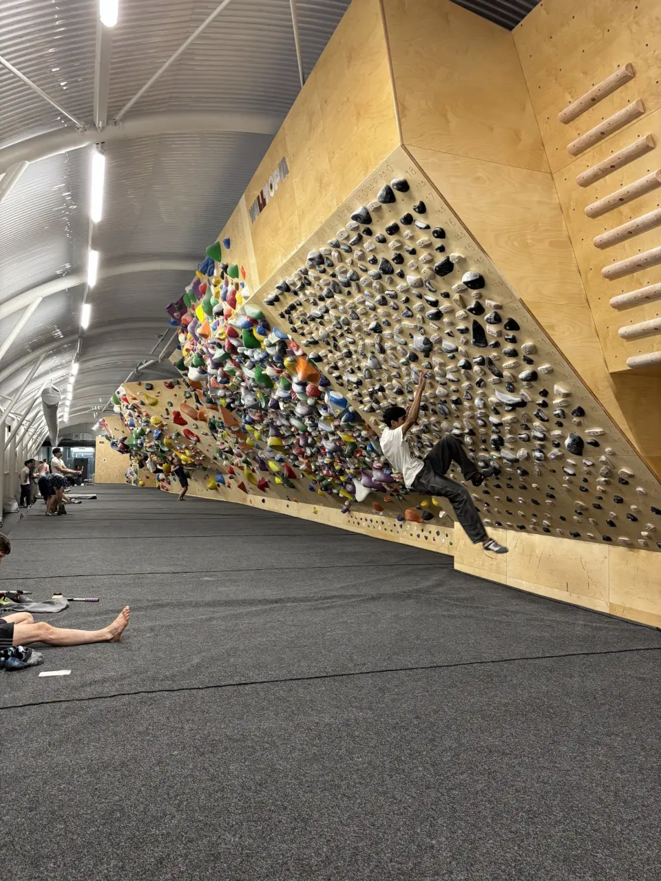 Climber on the overhanging spray wall