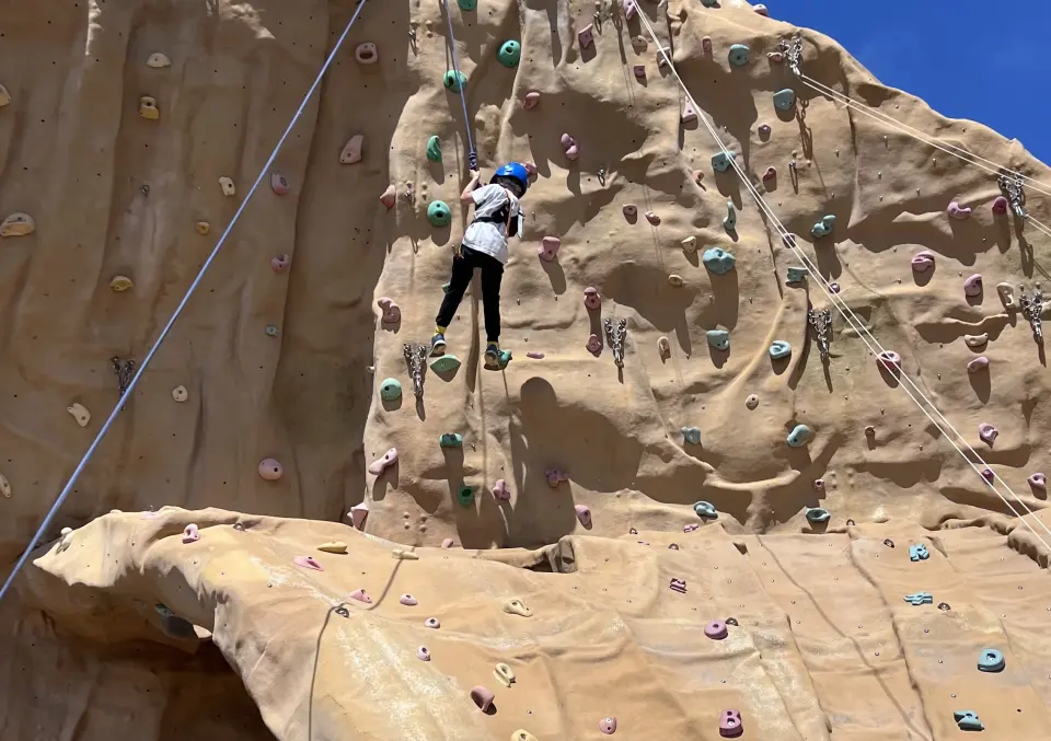 Climber on a top rope on the 12-metre outdoor Spinnaker wall