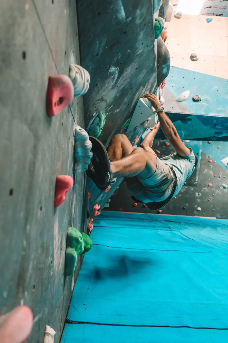 Climber on the steep blue wall