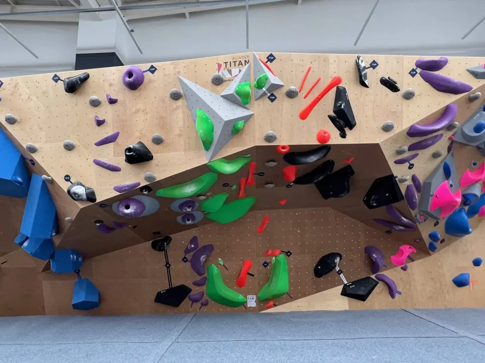 The Titan competition wall with large volumes and colourful holds
