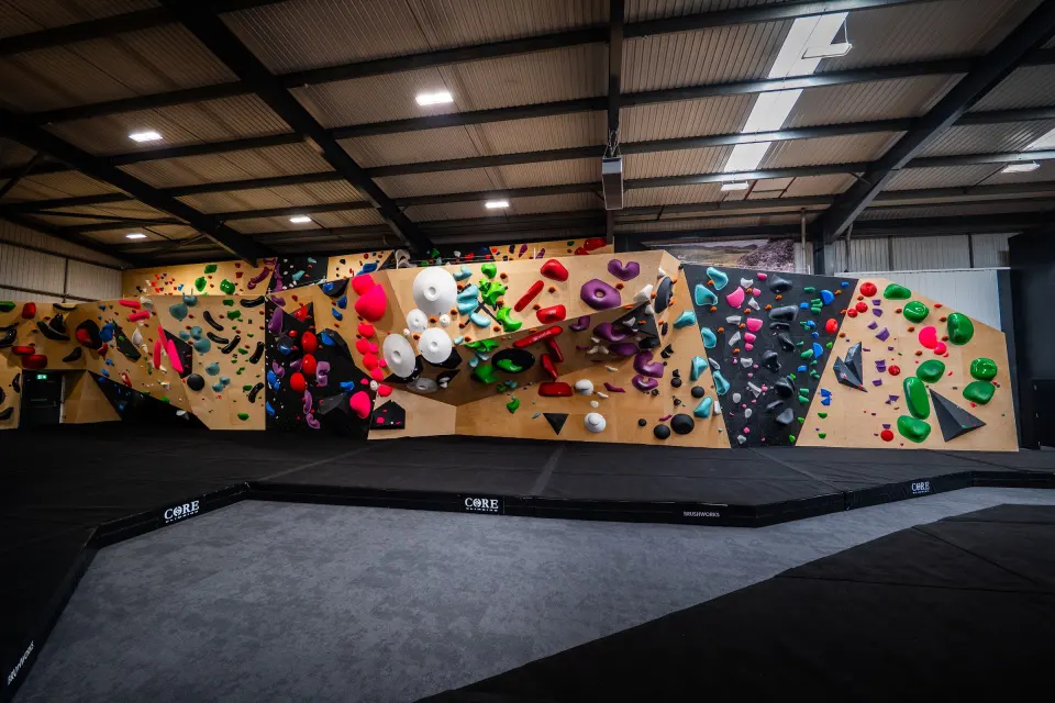Long run of bouldering walls in the main hall