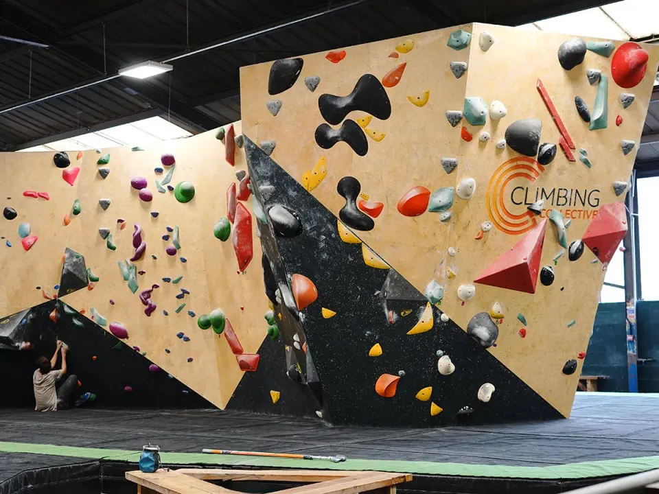 Freestanding boulder with black and wooden faces