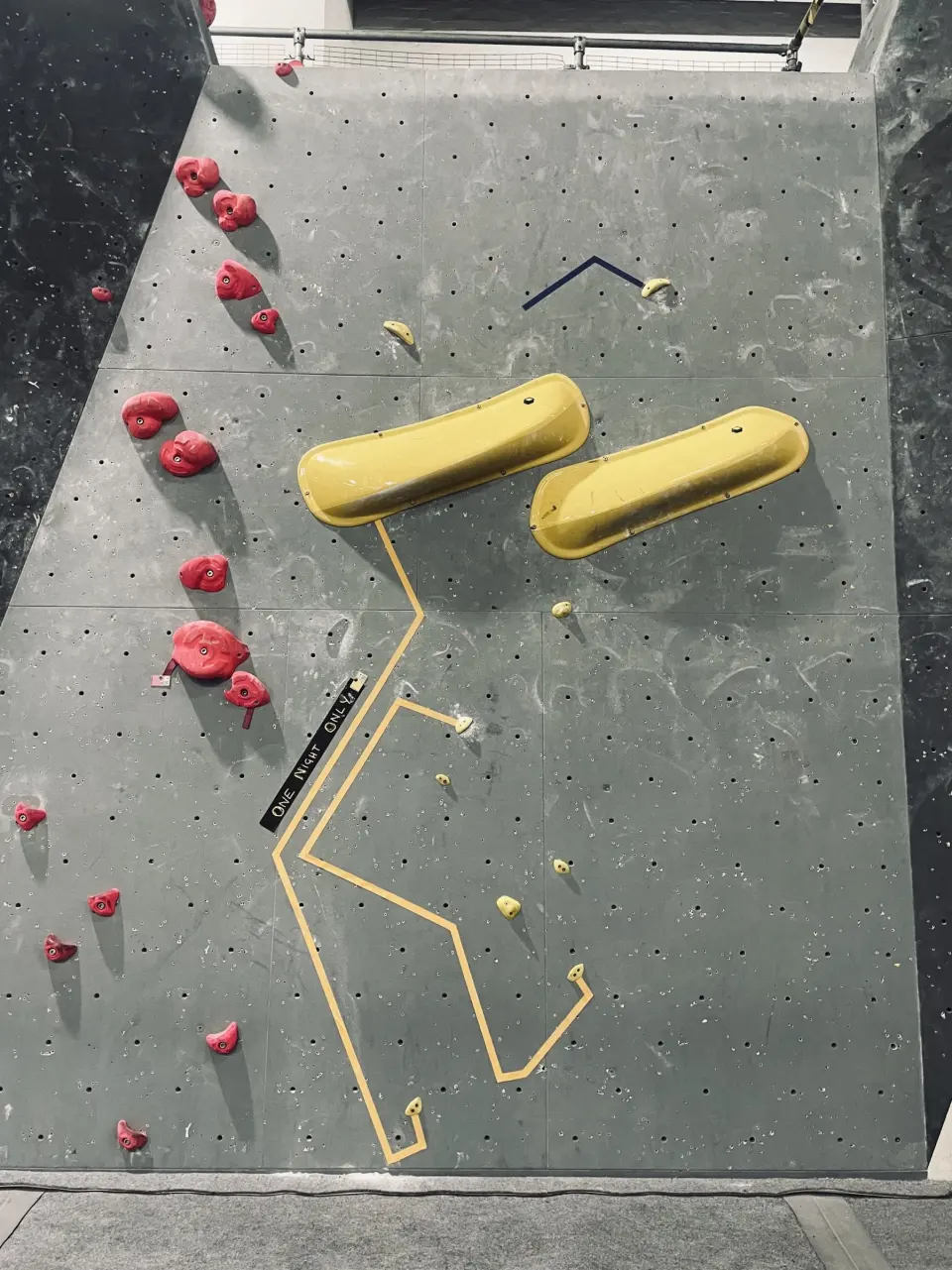 Slab with large yellow volumes and a taped problem