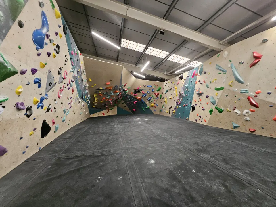 Corner of the bouldering hall with a steep cave beyond