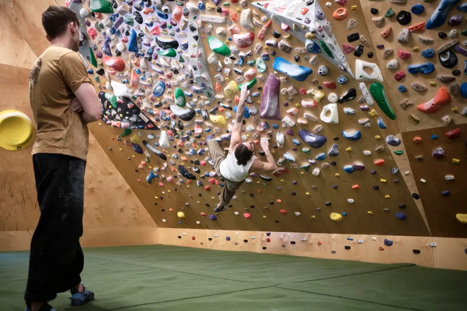 Climber on the densely packed spray wall