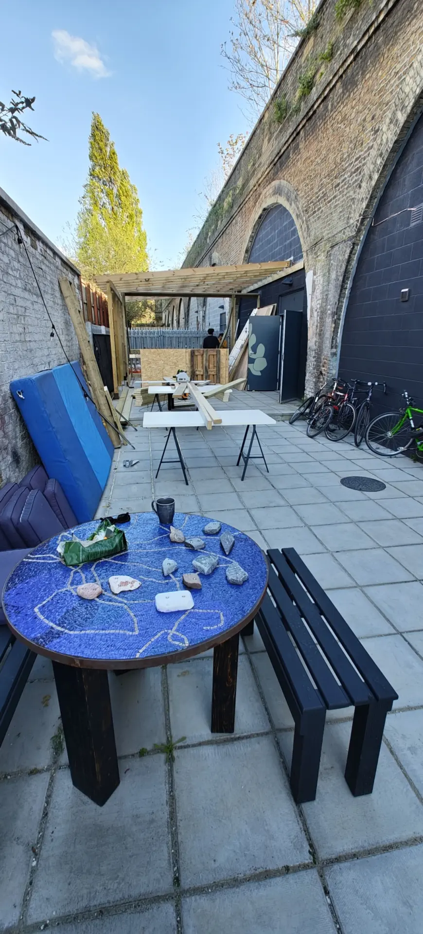 Garden seating behind the arch