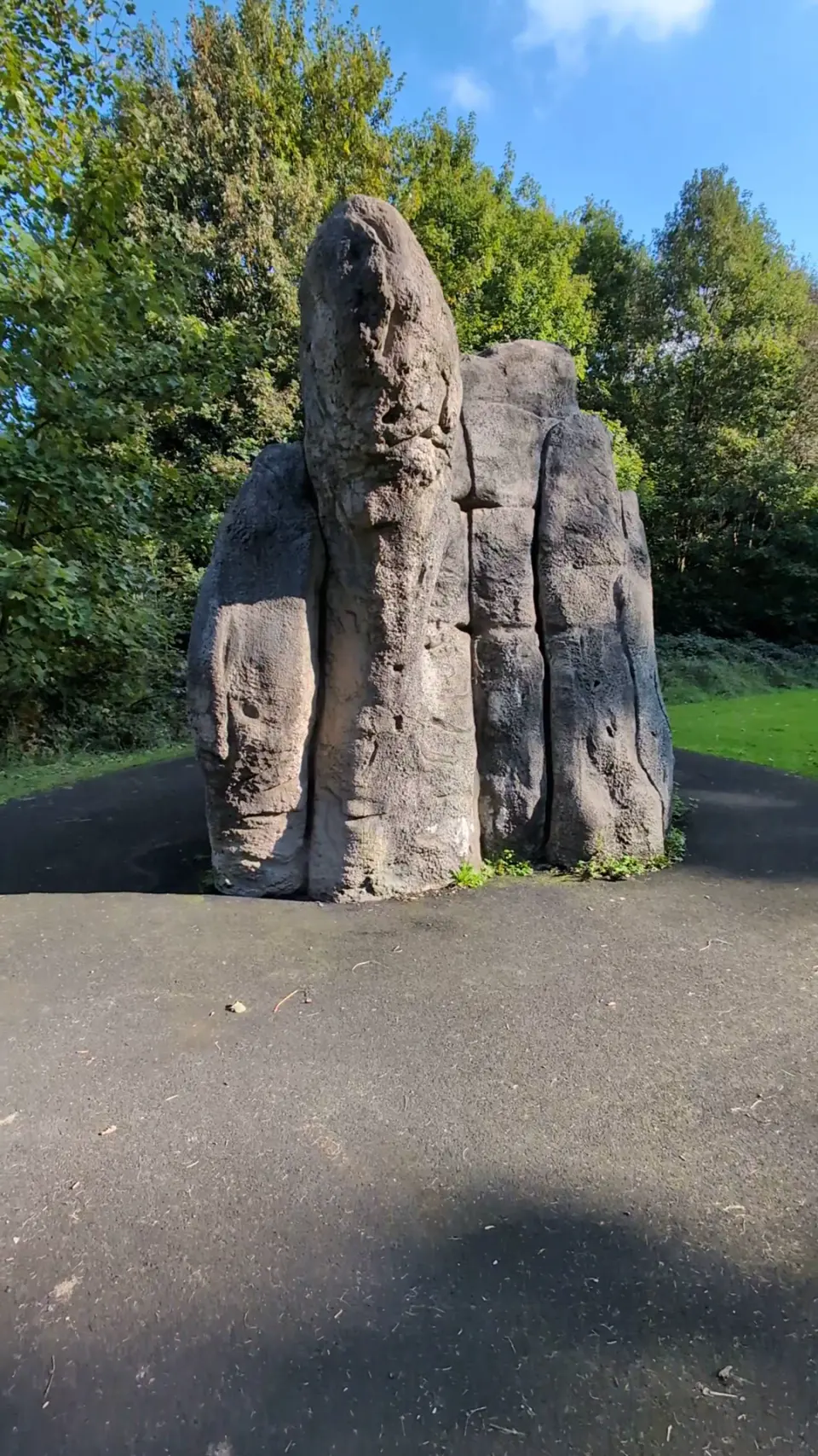 Narrow end of the boulder with its tall central pillar