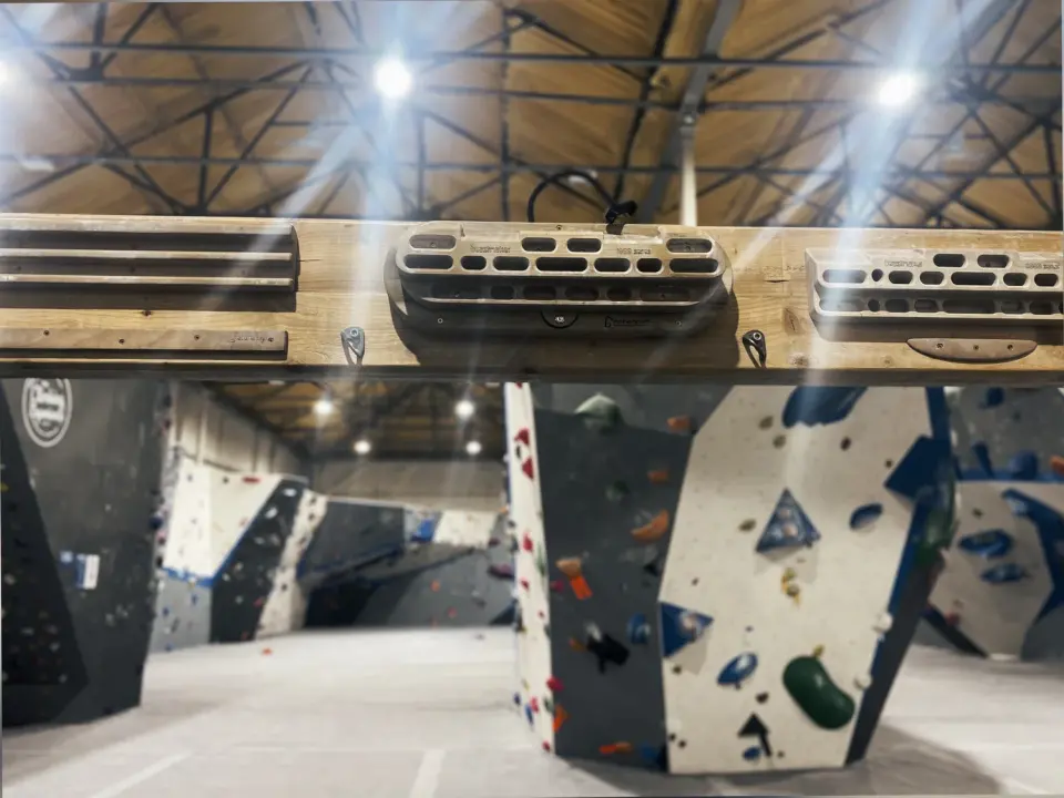 Hangboards above the bouldering walls in the warehouse hall at The Climbing Experience in Maidstone
