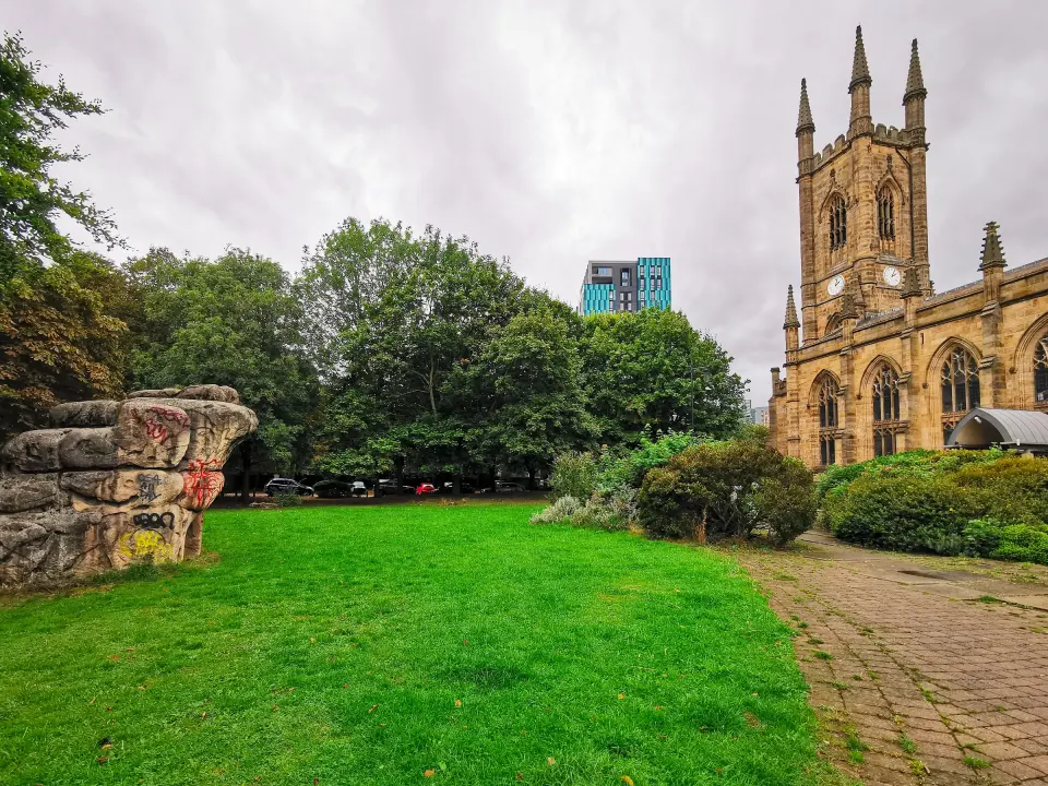 Small sculpted boulder on the lawn beside St Mary's Church tower