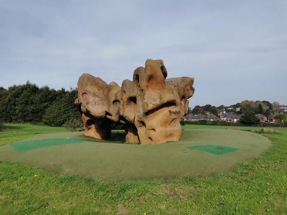 Sculpted climbing boulder on rubber safety surfacing in Richmond Park