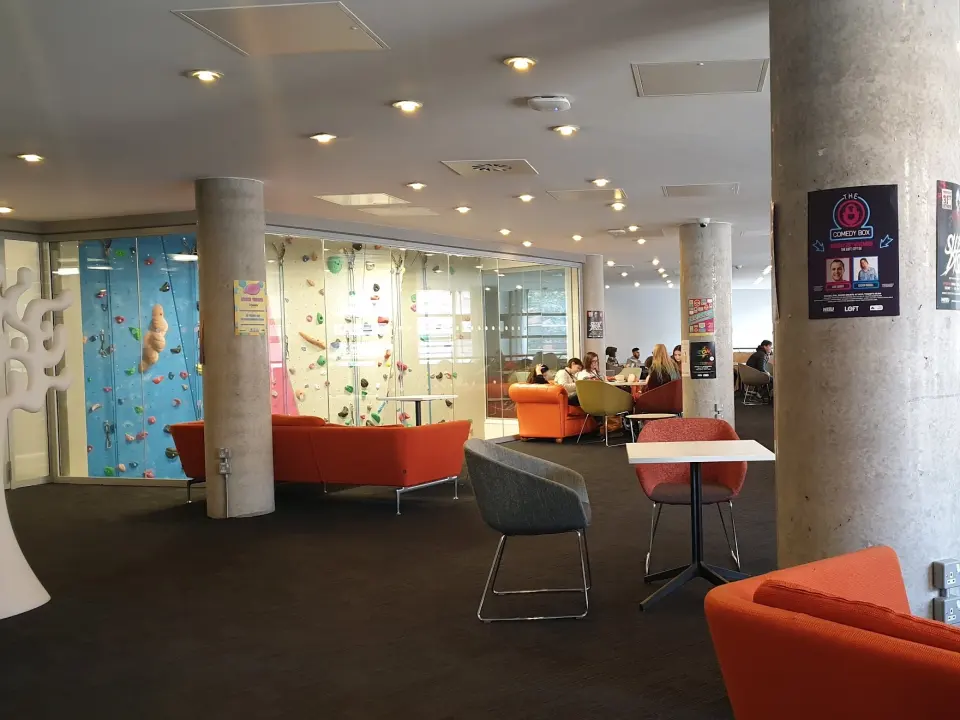 The glass-fronted climbing wall beside the Students' Union lounge