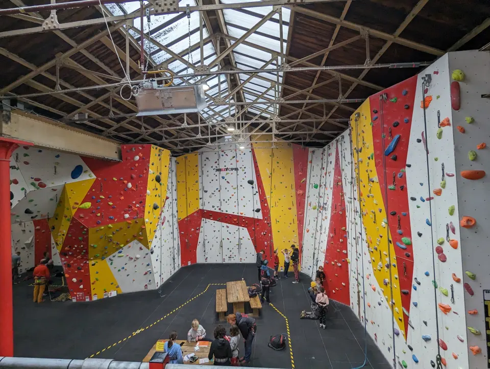 Red, yellow and white roped walls under the railway shed roof