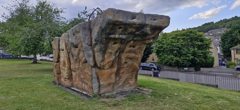 The boulder's overhanging prow above the park railings